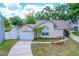 Inviting single-story home with a manicured lawn, one-car garage, and a cozy front yard landscape at 126 Spanish Moss Ct, Orlando, FL 32828