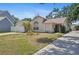 Beautiful single-story home with a well-maintained yard, attached garage, and inviting landscaping at 126 Spanish Moss Ct, Orlando, FL 32828