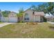 Lovely single-story home features a manicured lawn, attached garage, and charming landscaping at 126 Spanish Moss Ct, Orlando, FL 32828