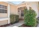 Cozy front porch with decorative plants, leading to a welcoming entrance at 126 Spanish Moss Ct, Orlando, FL 32828