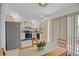Bright kitchen with stainless appliances and an adjacent breakfast nook at 126 Spanish Moss Ct, Orlando, FL 32828
