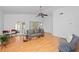 Bright living room with vaulted ceilings, hardwood floors, and plenty of natural light at 126 Spanish Moss Ct, Orlando, FL 32828