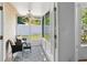 Screened patio with tile flooring, ceiling fan and outdoor seating arrangement at 126 Spanish Moss Ct, Orlando, FL 32828