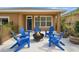 Backyard patio with fire pit and Adirondack chairs for outdoor relaxation at 12868 Holdenbury Ln, Windermere, FL 34786