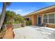 Backyard patio with a stucco fireplace at 12868 Holdenbury Ln, Windermere, FL 34786