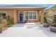 Backyard patio with a blue door and a stucco fireplace at 12868 Holdenbury Ln, Windermere, FL 34786