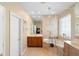 Elegant bathroom with soaking tub, double vanities, and a glass-enclosed shower at 12868 Holdenbury Ln, Windermere, FL 34786