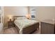 Cozy bedroom with neutral walls, carpet, and a window for natural light at 12868 Holdenbury Ln, Windermere, FL 34786