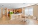 Cozy dining area next to kitchen features tile flooring, a pendant light and seating for six at 12868 Holdenbury Ln, Windermere, FL 34786