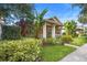 Charming home with a cozy front porch and lush tropical landscaping at 12868 Holdenbury Ln, Windermere, FL 34786
