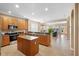 Open kitchen featuring granite countertops, island, stainless appliances, and seamless flow to the living space at 12868 Holdenbury Ln, Windermere, FL 34786