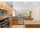 Spacious kitchen with granite countertops, stainless steel appliances, and a functional island at 12868 Holdenbury Ln, Windermere, FL 34786