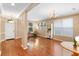 Bright living room with gleaming hardwood floors, tray ceiling and large windows at 12868 Holdenbury Ln, Windermere, FL 34786