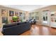 Inviting living room with hardwood floors and lots of natural light at 12868 Holdenbury Ln, Windermere, FL 34786