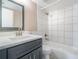 Newly renovated bathroom with modern vanity, quartz countertop, and tiled shower-tub combination at 1301 Winter Green Way, Winter Garden, FL 34787