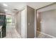 Hallway featuring a tile floor that leads to a living room at 1301 Winter Green Way, Winter Garden, FL 34787