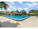 The community pool features lounge chairs and picnic tables at 1301 Winter Green Way, Winter Garden, FL 34787