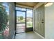 View from the screened porch showing the front door, exterior, and front lawn at 1301 Winter Green Way, Winter Garden, FL 34787