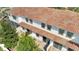 Aerial view of condos with red tile roofs, screened in patios, and well-maintained grounds at 14088 Tarvin St, Orlando, FL 32832