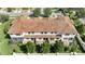 Aerial view of condo community featuring red tile roofs and manicured landscaping at 14088 Tarvin St, Orlando, FL 32832