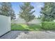 Landscaped backyard area with brick pavers and green grass and privacy fence at 14088 Tarvin St, Orlando, FL 32832