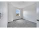 Bedroom features gray carpet, bright walls, and a large window at 14088 Tarvin St, Orlando, FL 32832