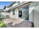 Brick patio with sliding glass door and view into the modern kitchen at 14088 Tarvin St, Orlando, FL 32832