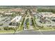 Aerial view of a town center featuring shopping and restaurants along beautifully landscaped streets at 14088 Tarvin St, Orlando, FL 32832
