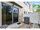 View of a back patio featuring an air conditioning unit and sliding glass door at 14242 Desert Haven St # Ge, Windermere, FL 34786