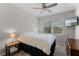 Cozy bedroom featuring two windows for natural light and a ceiling fan for added comfort at 14242 Desert Haven St # Ge, Windermere, FL 34786