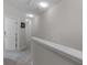 Bright hallway features neutral walls and carpet leading to the various rooms within the house at 14242 Desert Haven St # Ge, Windermere, FL 34786