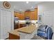 Open-concept kitchen featuring granite countertops and stainless steel appliances at 14242 Desert Haven St # Ge, Windermere, FL 34786