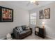Cozy living room with a gray couch and natural light from a window at 14242 Desert Haven St # Ge, Windermere, FL 34786