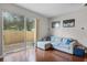 Living room featuring hardwood floors and sliding glass doors to outdoor area at 14242 Desert Haven St # Ge, Windermere, FL 34786