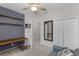 A well-lit office space featuring a desk, a couch, and a closet for storage at 14242 Desert Haven St # Ge, Windermere, FL 34786