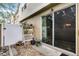 View of a patio with a sliding glass door, fence, garden decor, and stone pavers at 14242 Desert Haven St # Ge, Windermere, FL 34786