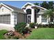 Charming home featuring a well-manicured lawn and beautiful landscaping in the front yard at 1430 Challenger Ave, Davenport, FL 33897