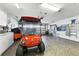 Spacious garage with epoxy floors, and plenty of storage, with room for a golf cart and storage at 1430 Challenger Ave, Davenport, FL 33897
