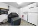 Finished garage featuring epoxy floors, a sink, a refrigerator, and extra storage at 1430 Challenger Ave, Davenport, FL 33897