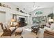 Inviting living room with lots of seating, a large window, decor shelving, and easy access to the outdoors at 1430 Challenger Ave, Davenport, FL 33897