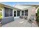 Relaxing outdoor patio area with comfortable seating, perfect for enjoying the fresh air at 1430 Challenger Ave, Davenport, FL 33897