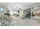 The sunroom is filled with bright light and has a sliding door to the living room, making it very convenient at 1430 Challenger Ave, Davenport, FL 33897