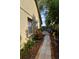 Paver path and landscaping line the exterior of the property at 1436 Swan Ct, Kissimmee, FL 34759