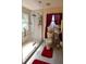 Bathroom featuring a glass door shower, a window with curtains, and a grey tile floor at 1436 Swan Ct, Kissimmee, FL 34759