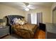 Bedroom with a black headboard, decorative pillows and a large plush bed at 1436 Swan Ct, Kissimmee, FL 34759