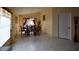 Bright dining room featuring tile floors, chandelier lighting, and a large table with seating at 1436 Swan Ct, Kissimmee, FL 34759
