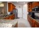 Well-lit kitchen featuring granite countertops, stainless appliances, and ample storage at 1436 Swan Ct, Kissimmee, FL 34759