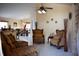 Open living room with tile floors and decorative seating that leads to the dining area at 1436 Swan Ct, Kissimmee, FL 34759