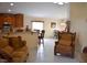 Inviting living room with tile flooring and comfortable seating open to the dining area at 1436 Swan Ct, Kissimmee, FL 34759
