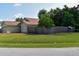 Well-maintained yard with lush green grass and a privacy fence surrounding the property at 1436 Swan Ct, Kissimmee, FL 34759